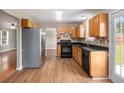 Well-equipped kitchen with stainless steel refrigerator and tile backsplash at 1000 Brushystone Dr, Loganville, GA 30052