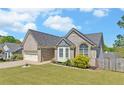 Beautiful house shows off a lawn, two car garage, bay window, and brick exterior at 2800 Araglin Dr, Dacula, GA 30019