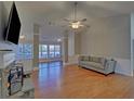 Cozy living room featuring a fireplace, hardwood flooring, and modern decor at 2800 Araglin Dr, Dacula, GA 30019