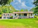 Charming home with well-manicured lawn and a two-car garage at 345 Etheridge Rd, Auburn, GA 30011