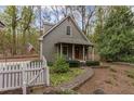 View of separate unit with green siding, white trim and stone paver walkway at 3521 Jefferson Township Pkwy, Marietta, GA 30066