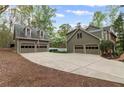 Three car detached garage with concrete parking pad at 3521 Jefferson Township Pkwy, Marietta, GA 30066