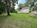 Expansive backyard with lush lawn extending from the back of the home at 7260 Dunhill Ter, Atlanta, GA 30328