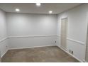 This bedroom has neutral-colored walls, trim, and carpet that is ready for your personal touches at 7260 Dunhill Ter, Atlanta, GA 30328