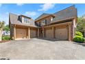 Spacious three-car garage with ample parking space and attractive brick detailing at 3562 Langley Oaks Se Ct, Marietta, GA 30067