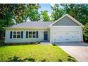 Charming one-story home with a two-car garage, well-manicured lawn, and blue shutters at 4694 E Glen Ridge E Cir, Winston, GA 30187