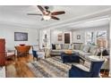 Bright living room with hardwood floors, neutral decor, and a comfortable seating area, great for relaxing at 1110 Tuxedo Dr, Roswell, GA 30075