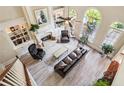 Spacious living room with high ceilings, a fireplace, built-in shelves, and ample natural light at 3704 Wilkins Cir, Powder Springs, GA 30127