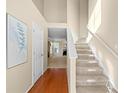 Bright, two-story foyer with hardwood floors and a staircase at 877 Ashwood Walk, Decatur, GA 30030
