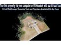 An aerial of the property with a long drive and good tree coverage around the property at 645 Woodwind Dr, Rockmart, GA 30153