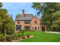 Beautiful brick home with a charming portico and manicured lawn at 808 Lullwater Ne Rd, Atlanta, GA 30307