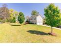Well-maintained home featuring a spacious front yard and a two-car garage at 15 Cobblestone Ct, Douglasville, GA 30134