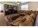 Cozy living room with comfortable seating, a large TV, and natural light at 15 Cobblestone Ct, Douglasville, GA 30134