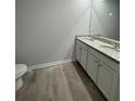 Bathroom featuring a double vanity with granite countertops and modern fixtures at 111 Deer Xing, Temple, GA 30179