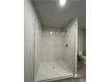 Modern walk-in shower with subway tile and a clear glass partition at 111 Deer Xing, Temple, GA 30179