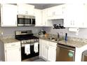 Well-lit kitchen with stainless steel appliances and granite countertops at 3420 Caley Mill Ln, Powder Springs, GA 30127