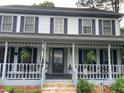 Inviting front porch with classic columns and space for relaxing at 3546 Mount Vernon Ct, Lawrenceville, GA 30044
