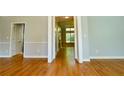 Inviting living room showcasing hardwood floors and neutral wall colors, creating a warm and welcoming atmosphere at 974 Regal Hills Ln, Mableton, GA 30126