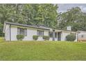 Classic brick home with well-maintained lawn and modern, dark-trimmed accents at 2714 Preston Dr, Decatur, GA 30034