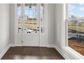 Bright entryway featuring dark wood floors, French doors, and a large window, offering plenty of natural light at 171 Basil Street Dr, Cumming, GA 30040