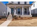 Beautiful home exterior showcasing a well-maintained lawn and classic architectural details at 171 Basil Street Dr, Cumming, GA 30040
