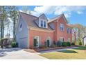 Attached two car garage and tidy landscaping on this brick and siding home at 2195 Brickton Sta, Buford, GA 30518