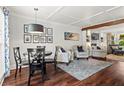 Cozy living room with a dining area, hardwood floors, and modern decor at 2801 Livsey Dr, Tucker, GA 30084