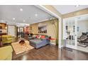 Open-concept living area with hardwood floors and large windows, creating a bright and inviting space at 3201 Lenox Ne Rd # 22, Atlanta, GA 30324