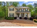 Charming two-story home featuring a classic design, well-maintained landscaping, and a welcoming front porch at 480 Springs End Ne Ln, Marietta, GA 30068