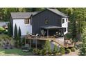 Stunning backyard featuring a large deck, screened porch, and lush landscaping at 132 Lakeshore Ne Dr, Marietta, GA 30067