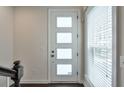 Bright entryway featuring a white door with glass panes and a window with blinds at 2032 Holtz Ln, Atlanta, GA 30318