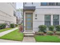 Close up of a home's front door with a modern design and manicured landscaping at 2032 Holtz Ln, Atlanta, GA 30318