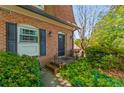 Charming brick townhouse with a well-maintained front yard and black door at 1261 Lavista Ne Rd # J-4, Atlanta, GA 30324
