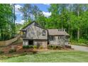 Charming exterior showcasing a well-maintained lawn, stone accents, and a cozy front porch at 3603 Allpoint Dr, Marietta, GA 30062