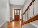 Welcoming foyer featuring a beautiful front door and hardwood floors at 503 Pinehurst Ln, Woodstock, GA 30188