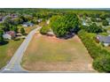 Spacious vacant lot surrounded by mature trees, offering privacy and potential for a custom build at 1312 Harbins Rd, Dacula, GA 30019