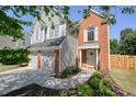 Two story home with brick and siding, showcasing a welcoming entrance and manicured landscaping at 2525 Ashton Dr, Roswell, GA 30076