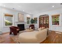 Bright living room features hardwood floors, fireplace, modern furnishings and french doors at 446 Harold Ne Ave, Atlanta, GA 30307