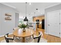 Inviting dining area featuring a round table with seating for four and stylish pendant lighting at 4201 Stratford Commons, Decatur, GA 30033