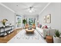 Stylish living room with large windows, ample natural light, and hardwood floors at 4201 Stratford Commons, Decatur, GA 30033