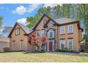 Beautiful home featuring a mix of stucco and stone exterior, complemented by a well-kept lawn at 4609 Mctyre Way, Marietta, GA 30064