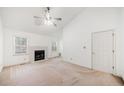 Spacious living room with a vaulted ceiling, fireplace, and lots of natural light at 595 Saint James Se Walk, Marietta, GA 30067