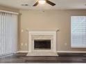 Cozy living room showcasing a classic fireplace and hardwood floors at 6401 Wedgeview Ct # 6401, Tucker, GA 30084
