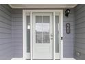 Close-up of the front door with sidelights, showcasing the house number and modern hardware at 900 Hillary Ln, Lawrenceville, GA 30043