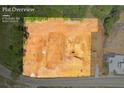 Aerial view of the lot showing the cleared land, ready for construction, surrounded by trees at 409 Thunder Rd, Buford, GA 30518