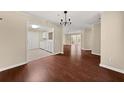 Dining room with hardwood floors, access to living areas, and adjacent kitchen at 2605 Vineyard Se Way, Smyrna, GA 30082