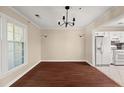 Dining room featuring hardwood floors, chandelier, and large windows at 2605 Vineyard Se Way, Smyrna, GA 30082