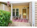 Cozy front porch with seating area and decorative rug, welcoming entrance to the home at 2605 Vineyard Se Way, Smyrna, GA 30082