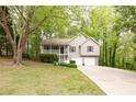 Inviting two-story home featuring a covered front porch and an attached two-car garage at 69 Due West Pass, Dallas, GA 30157