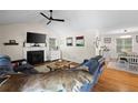 Comfortable living room with a fireplace, vaulted ceilings, and hardwood floors at 69 Due West Pass, Dallas, GA 30157